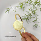 Brush textured round center open cuff bracelet