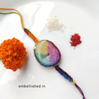 Solar Agate Slice Rakhi with Handwoven Rainbow Cord