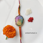 Solar Agate Slice Rakhi with Handwoven Rainbow Cord