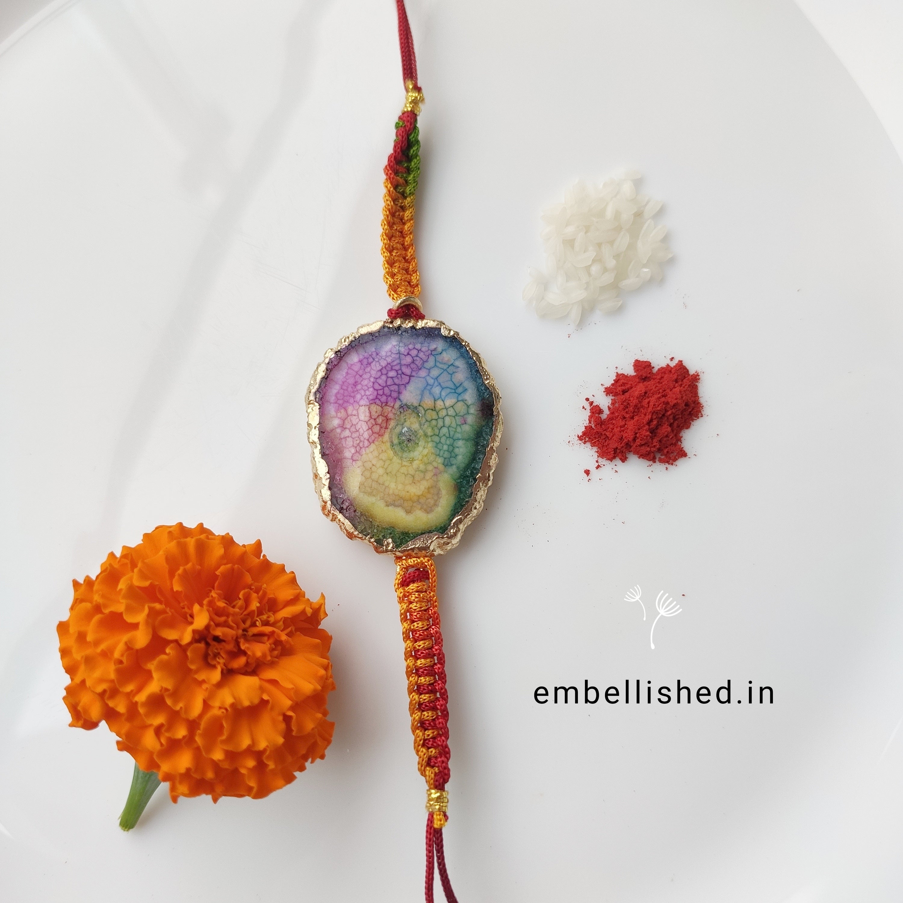 Solar Agate Slice Rakhi with Handwoven Rainbow Cord