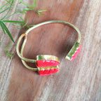 Three stones medley open bangle - coral