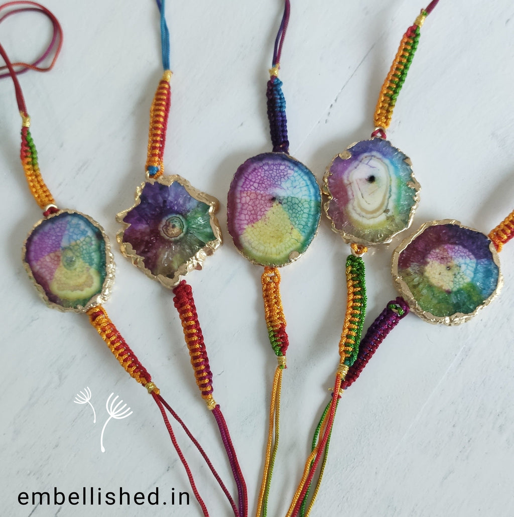 Solar Agate Slice Rakhi with Handwoven Rainbow Cord